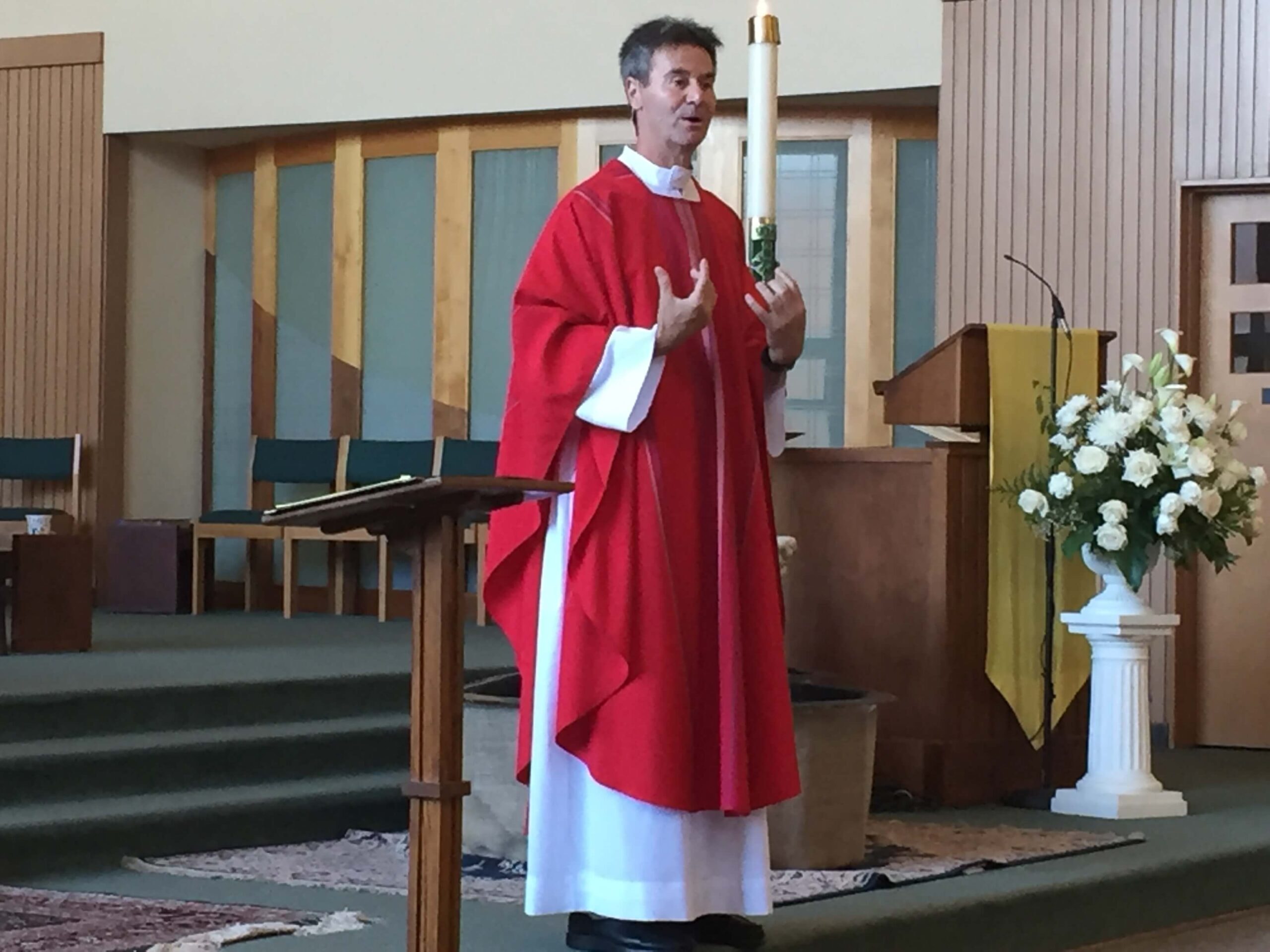 Fr. Cedric preaching during a church service